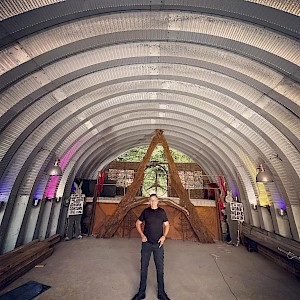 Mark standing in the empty chapel